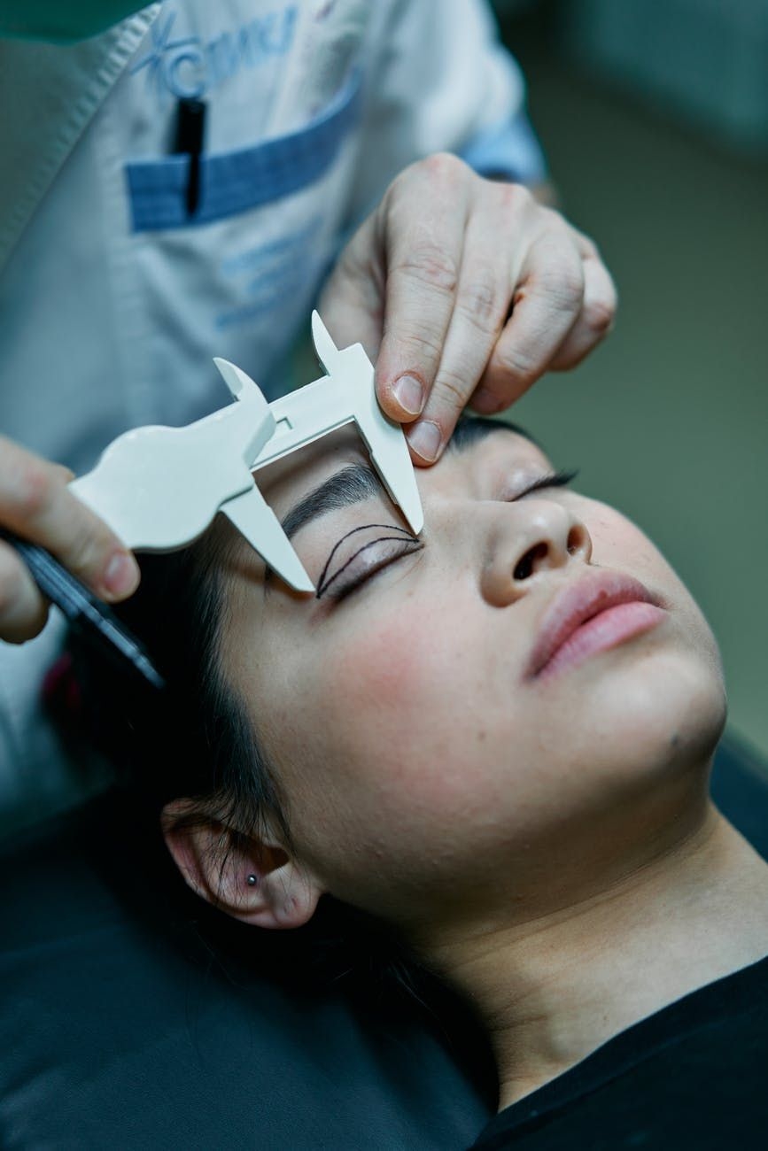 girl getting eye examined