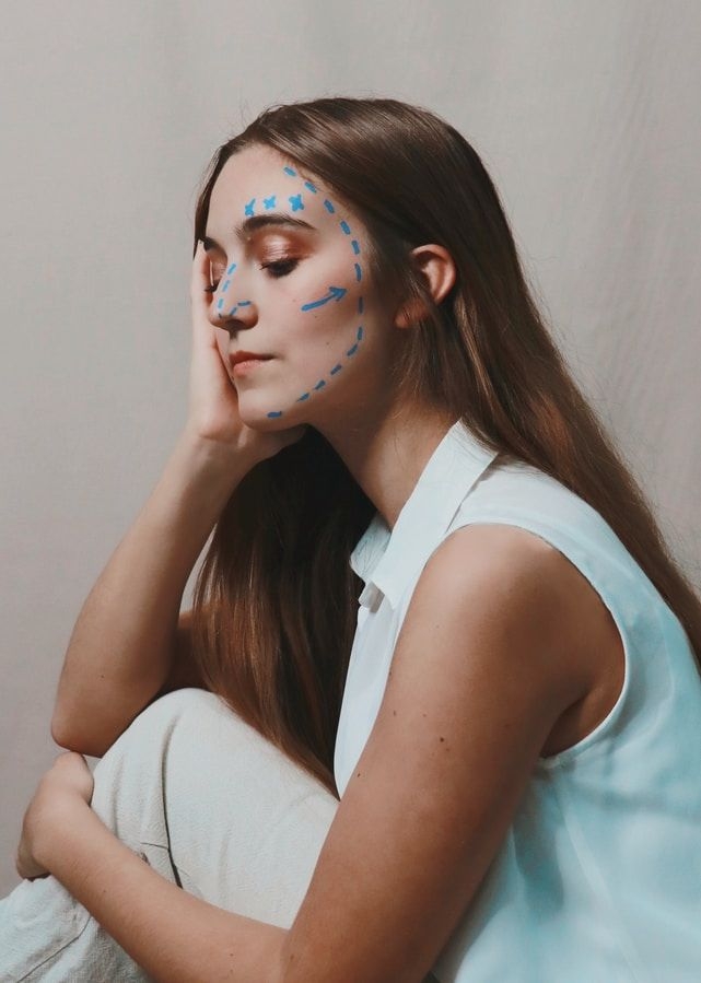 girl with surgery lines on face